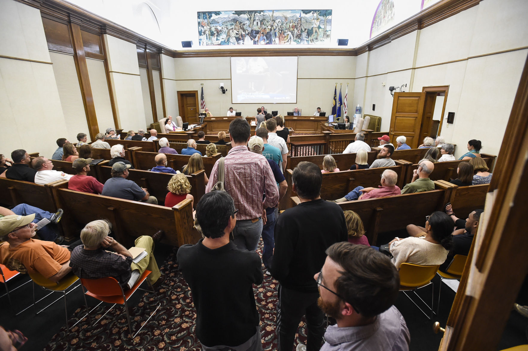 People wait in line to testify before the Helena City Commission Tuesday regarding the Confederate Fountain in Hill Park.